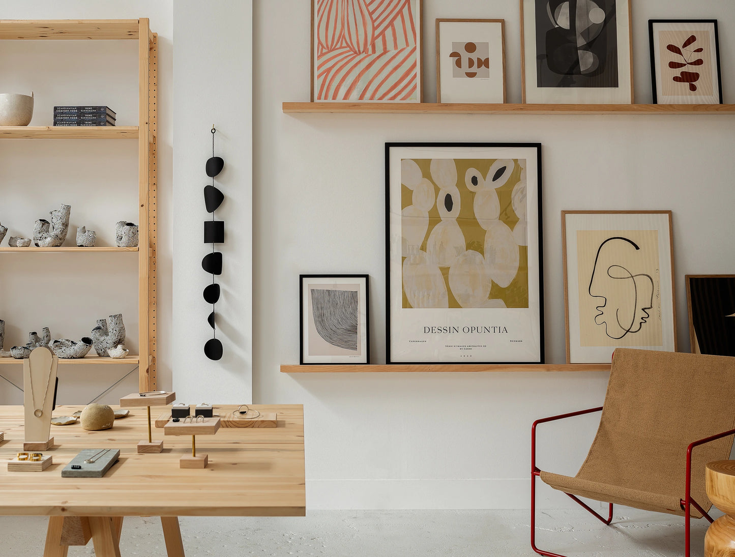 Scandi-minimalist store display of prints, jewelry, and furniture at Woodland Mod's store in Seattle