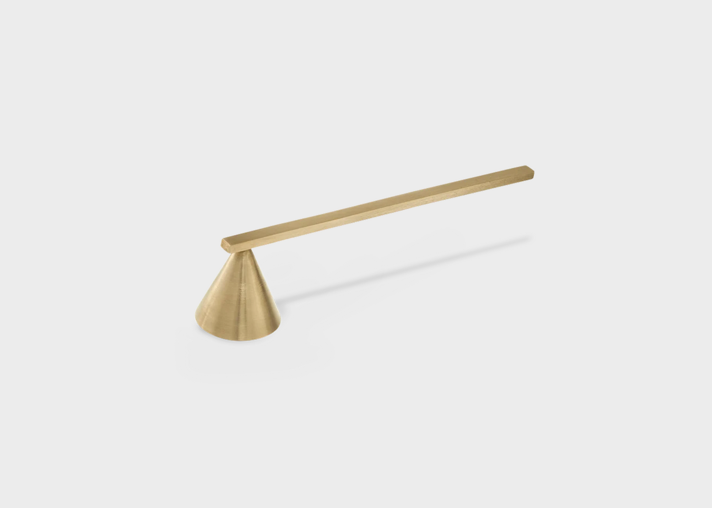 A brass candle extinguisher by Ferm Living with a cone extinguisher and long straight handle as sold by Woodland Mod