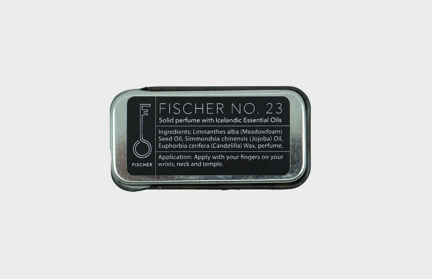 The back side of Fischersund's No 23 solid perfume container