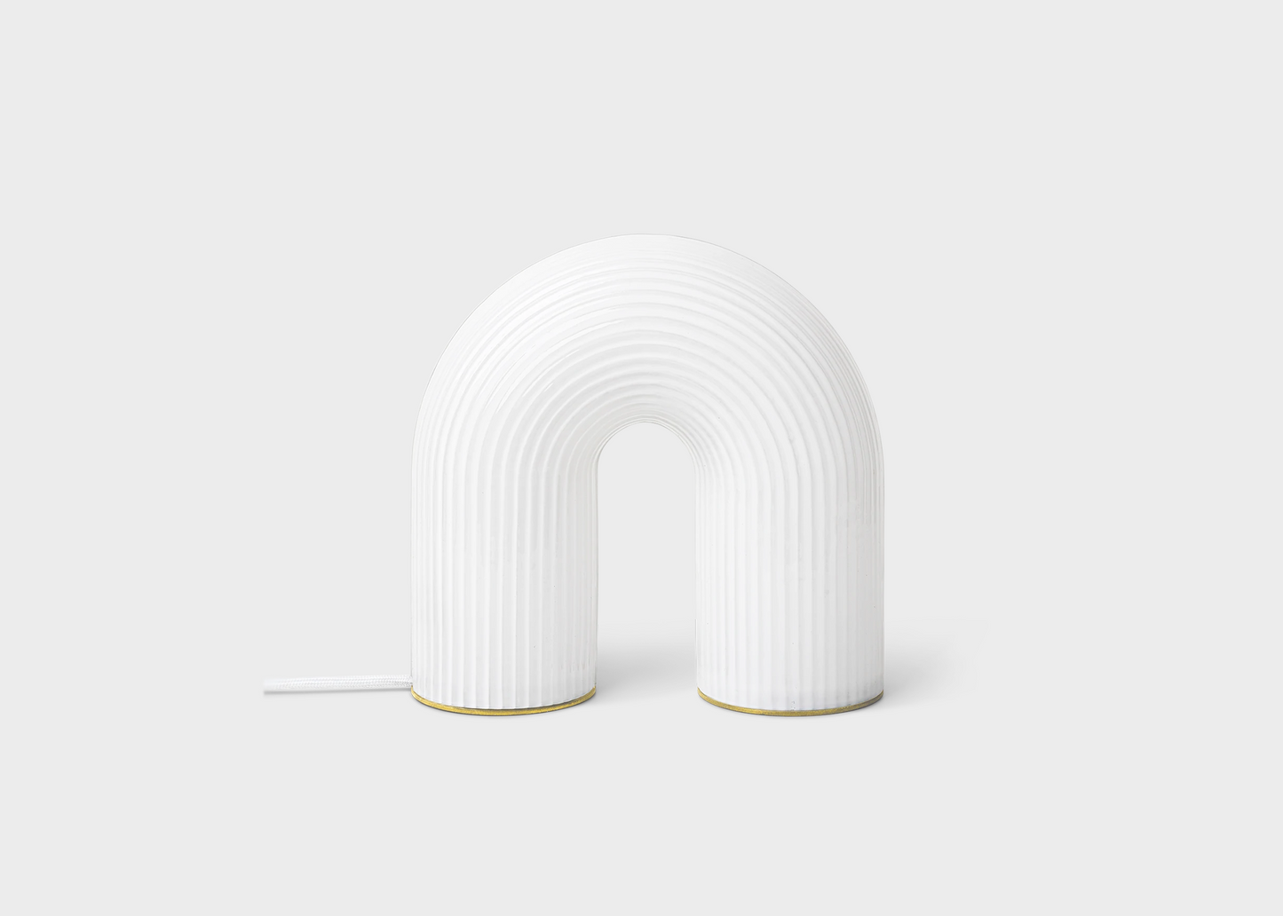 The arched white Vuelta Lamp by Ferm Living as sold by Woodland Mod