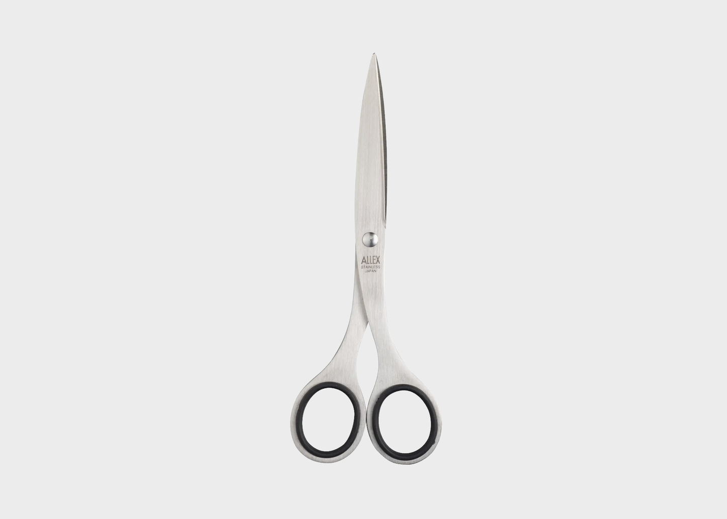 
                  
                    A pair of scissors with silver stainless steel blades and black-rimmed oval handles, centered on a light gray background.
                  
                