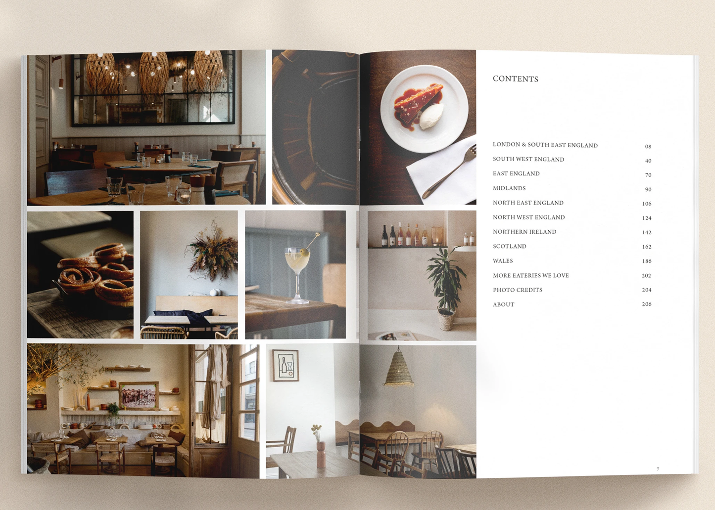 
                  
                    An open printed menu or brochure spread laid on a light beige surface. The left page contains a collage of restaurant and interior photography with food and decor photos.
                  
                