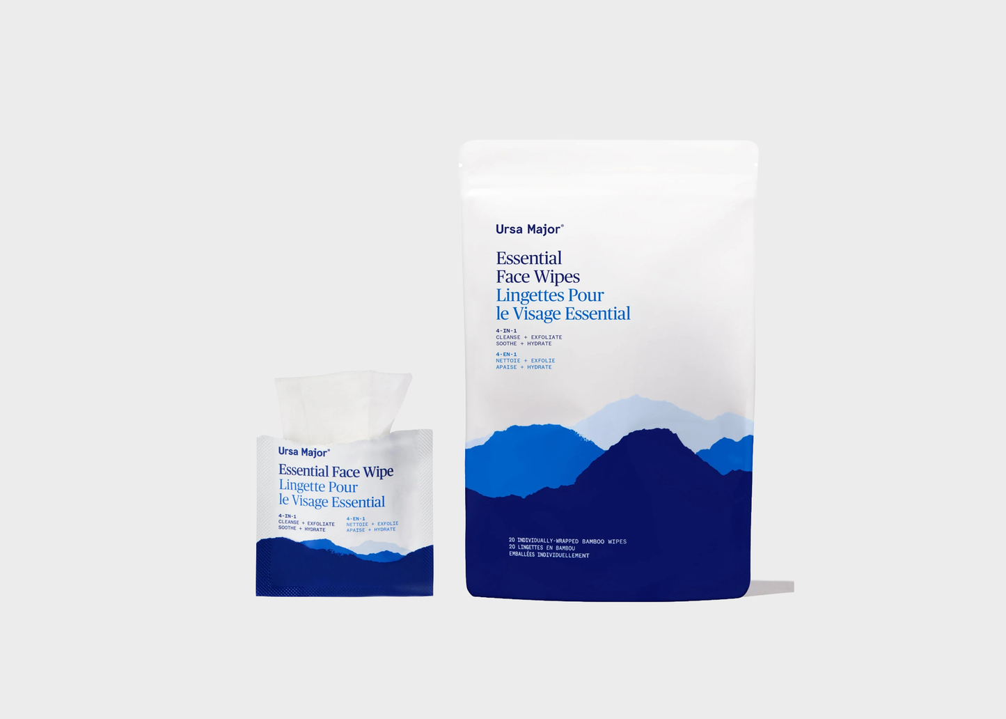 
                  
                    Ursa Major Essential Face Wipes packaging, featuring a large white pouch with blue mountain graphics and a smaller matching single-use packet, set against a light gray background.
                  
                
