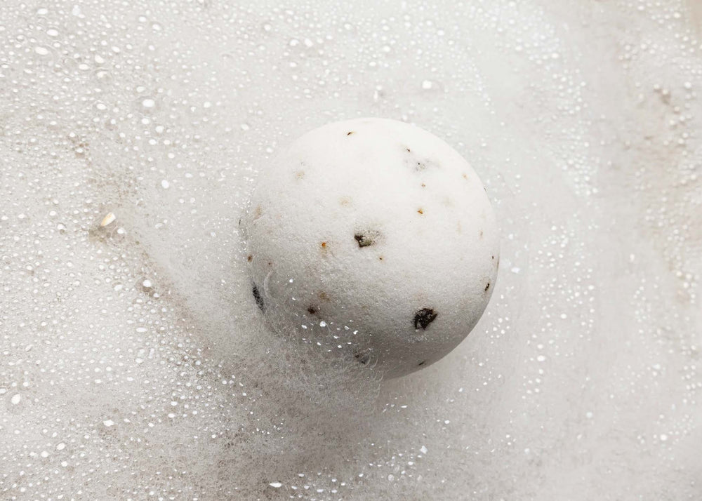 
                  
                    Eudaimonia Bath Bomb by Humdakin in a tub with bubbles
                  
                