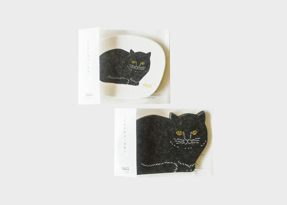 Letterpress black cat coasters by Tomo in packaging.