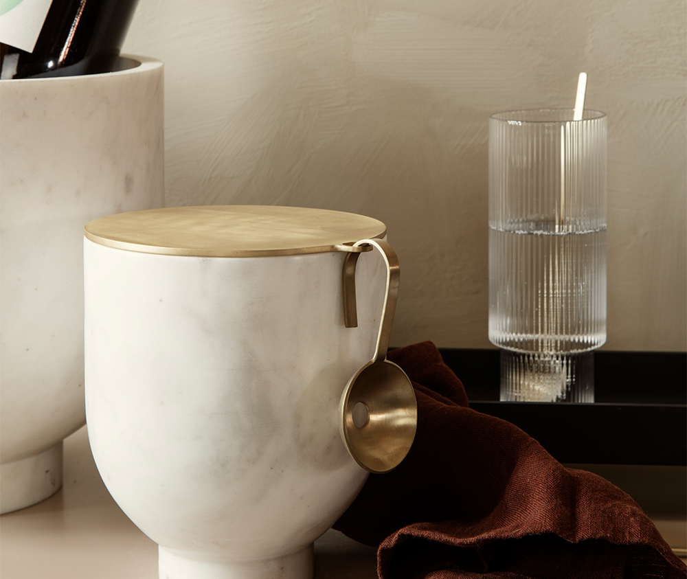 Ferm Living's ice bucket and ripple glass in a kitchen setting
