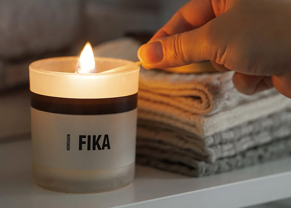 Fika Humdakin Candle being lit with a match