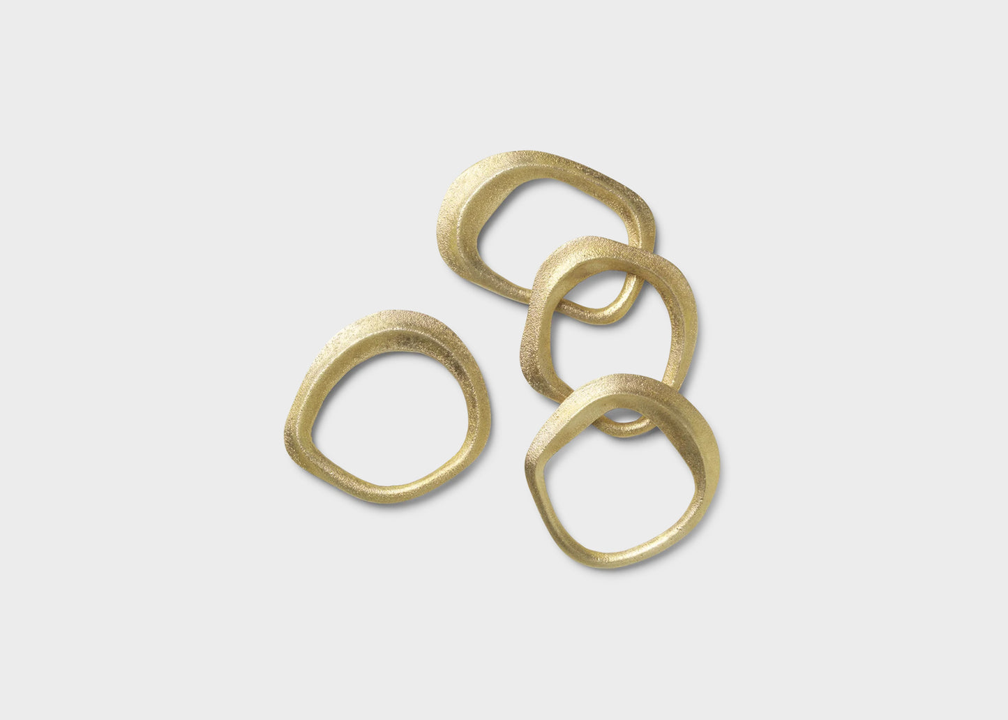 
                  
                    Flow Napkin Ring Set by Ferm Living in Brass
                  
                