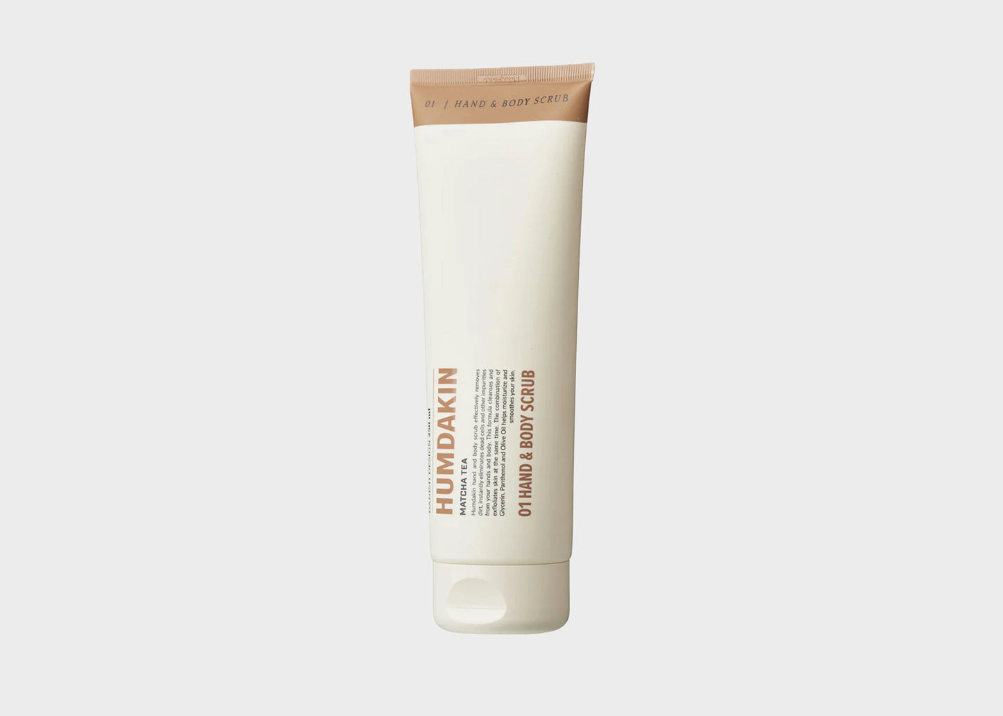 
                  
                    A white cream bottle of Matcha Tea 01 Hand and Body Scrub by Humdakin as sold by Woodland Mod
                  
                