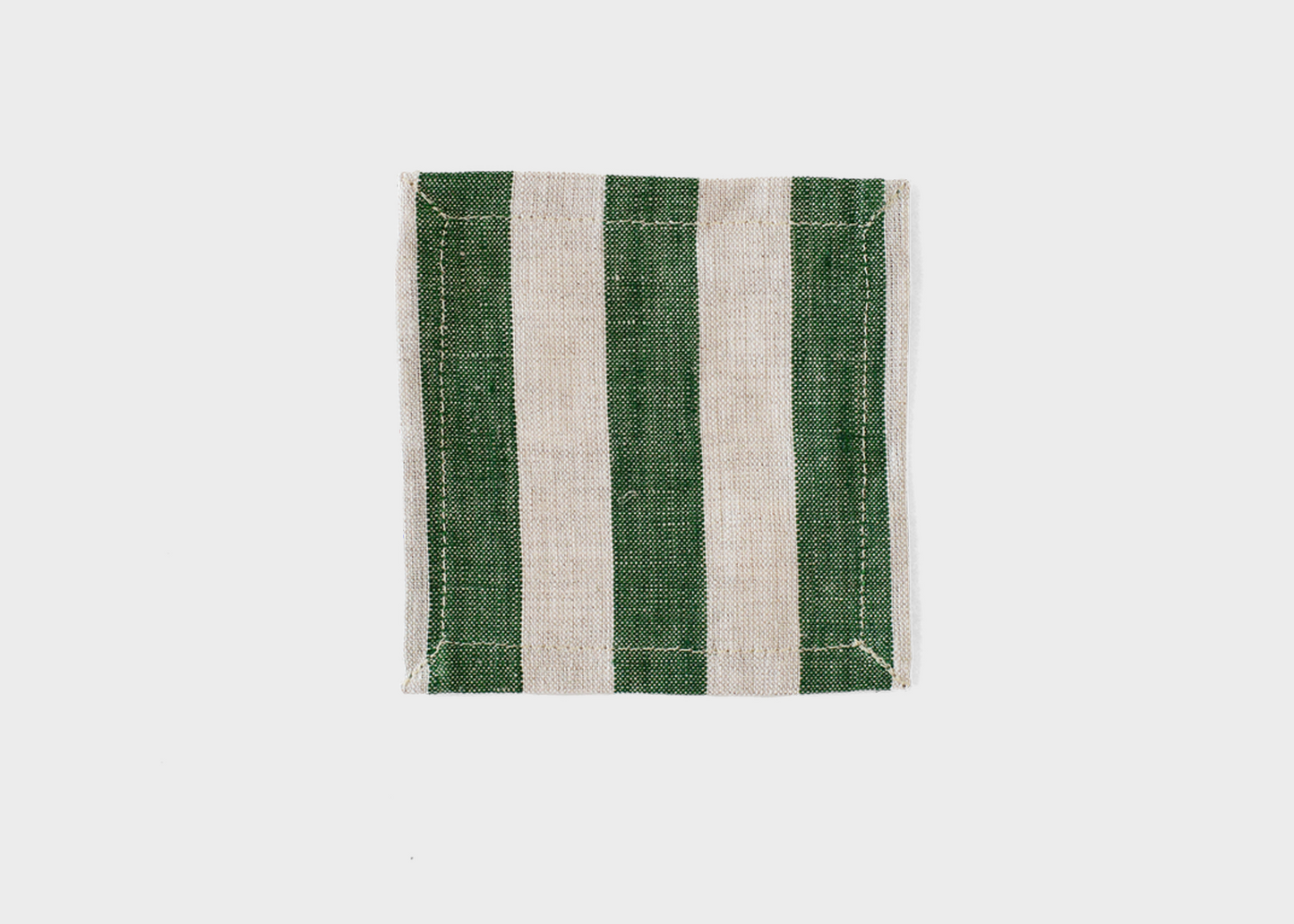 Green and white striped fabric coaster on a white background