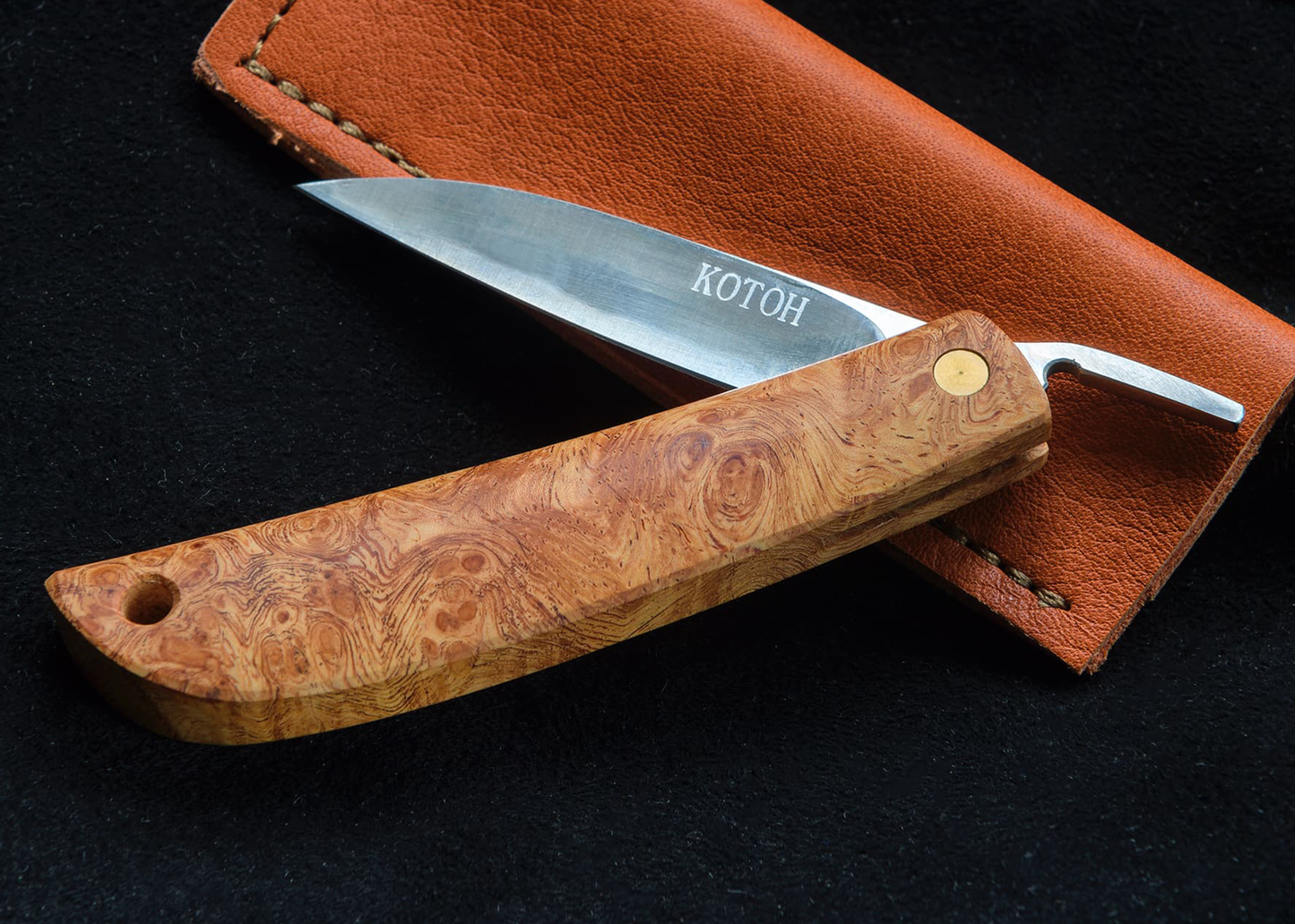 
                  
                    Opened kotoh knife with leather sheath 
                  
                