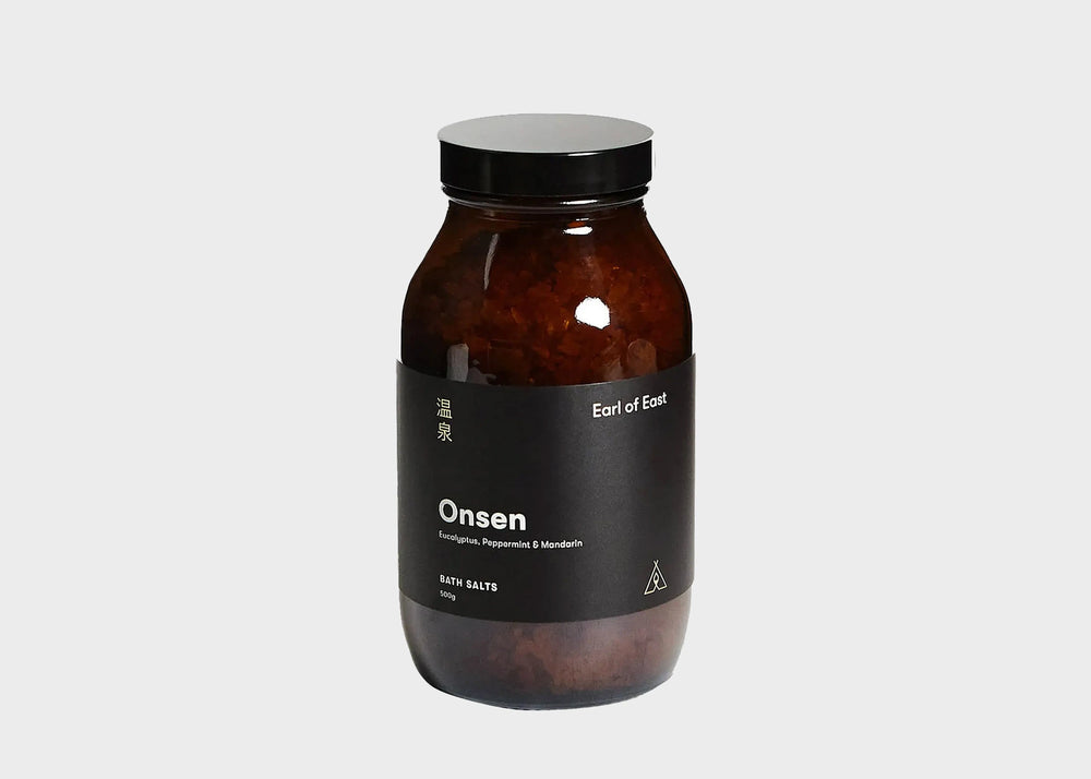 A dark glass jar of Onsen bath salts by Earl of East as sold by Woodland Mod