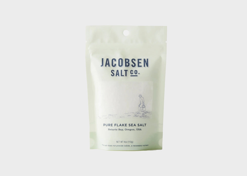 A light green bag full of Pure Flake Sea Salt by Jacobsen Salt Co. as sold by Woodland Mod