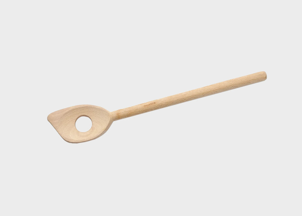
                  
                    A wooden risotto spoon with a hold in the middle of the spoon as sold by Woodland Mod
                  
                
