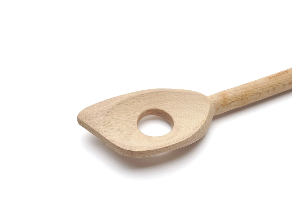 
                  
                    A close up of the wooden risotto spoon with a hole in the spoon as sold by Woodland Mod
                  
                