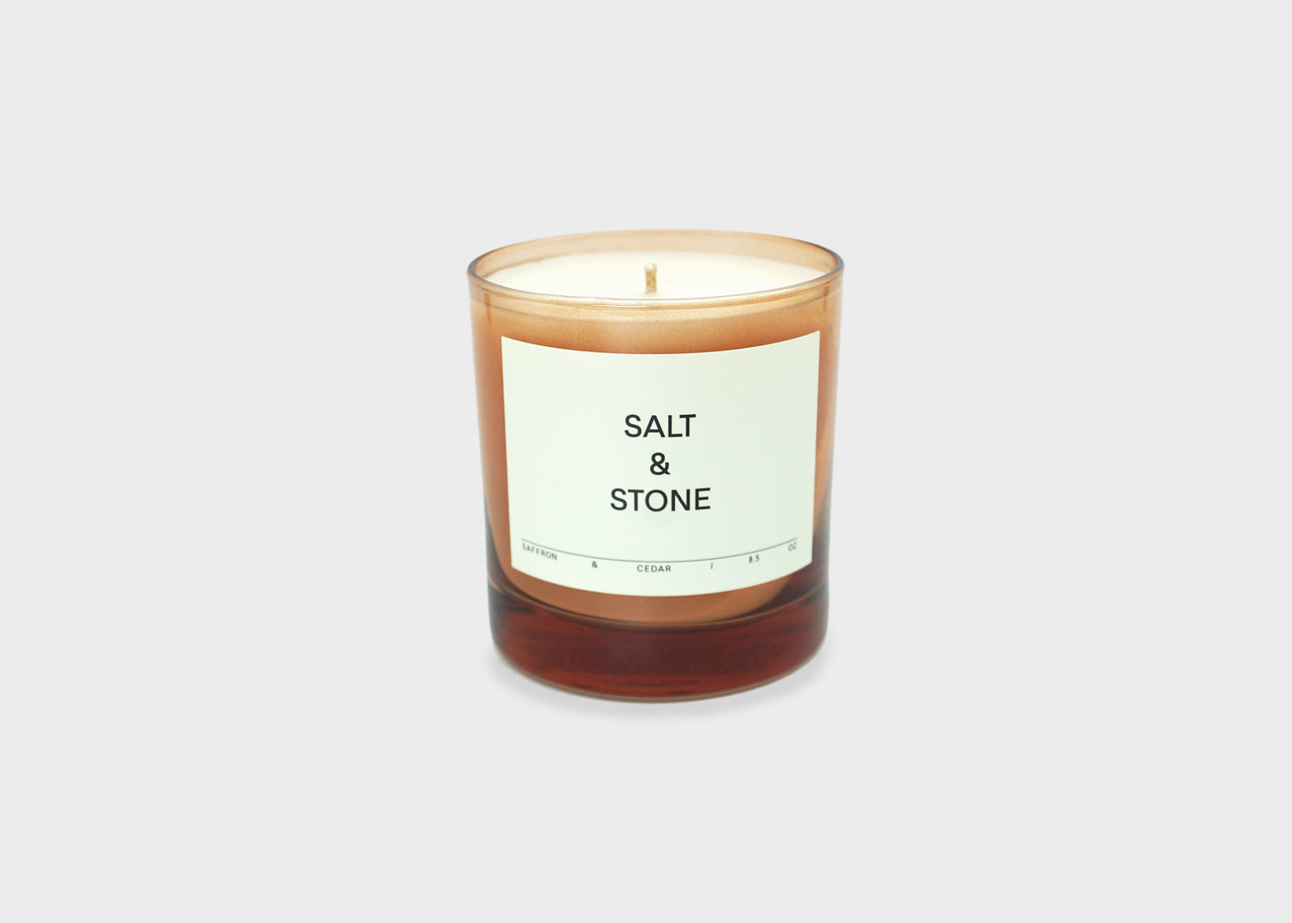 
                  
                    Saffron & Cedar Candle by Salt and Stone with pink glass
                  
                