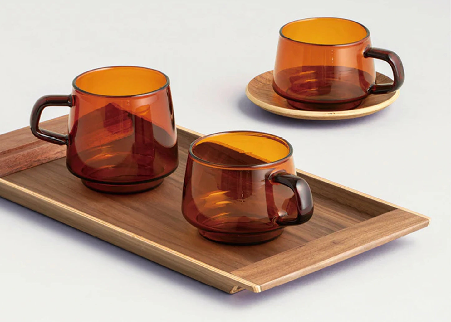 
                  
                    Sepia mugs by KINTO resting on the Sepia Non slip tray by KINTO 
                  
                