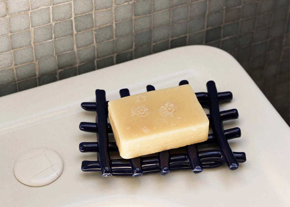 
                  
                    Ceramic Soap Tray - Blue by Ferm Living with soap on it
                  
                
