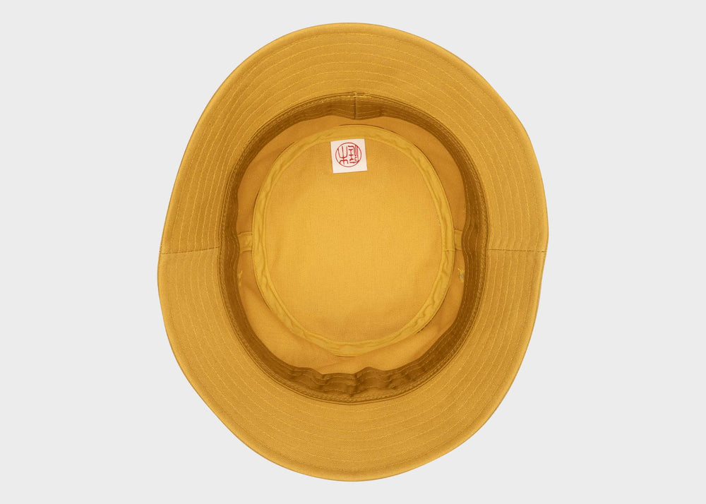 
                  
                    The underside of the Niwaki Hiyoke Hat in Yellow as sold by Woodland Mod
                  
                