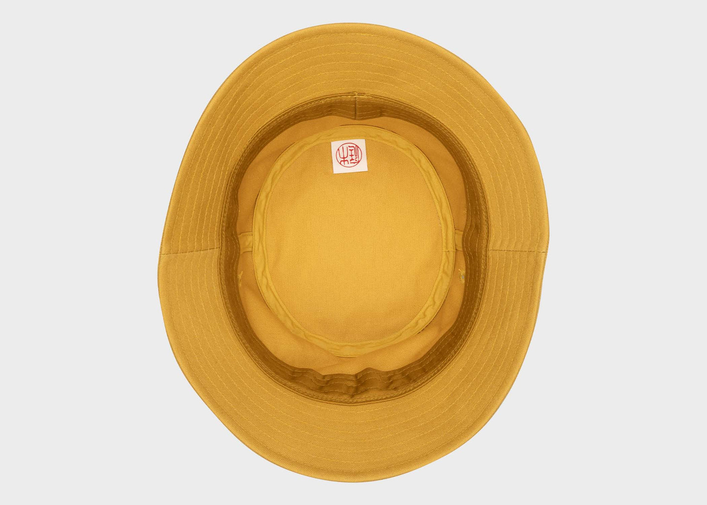 
                  
                    The underside of the Niwaki Hiyoke Hat in Yellow as sold by Woodland Mod
                  
                