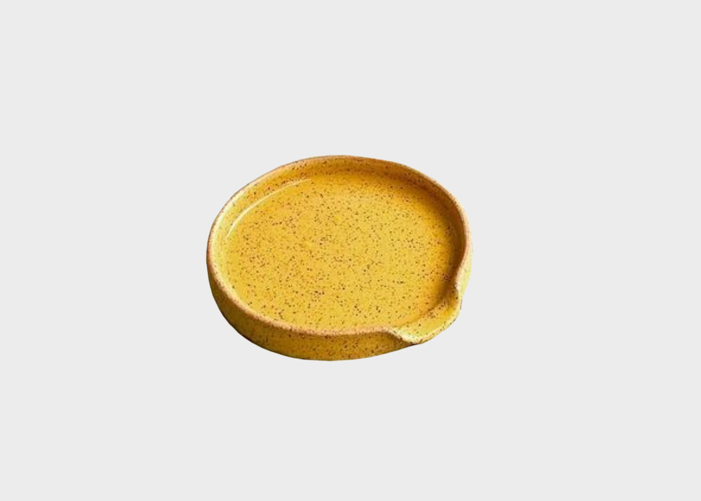 
                  
                    A yellow ceramic spoon rest by BYUN ceramics as sold by Woodland Mod
                  
                