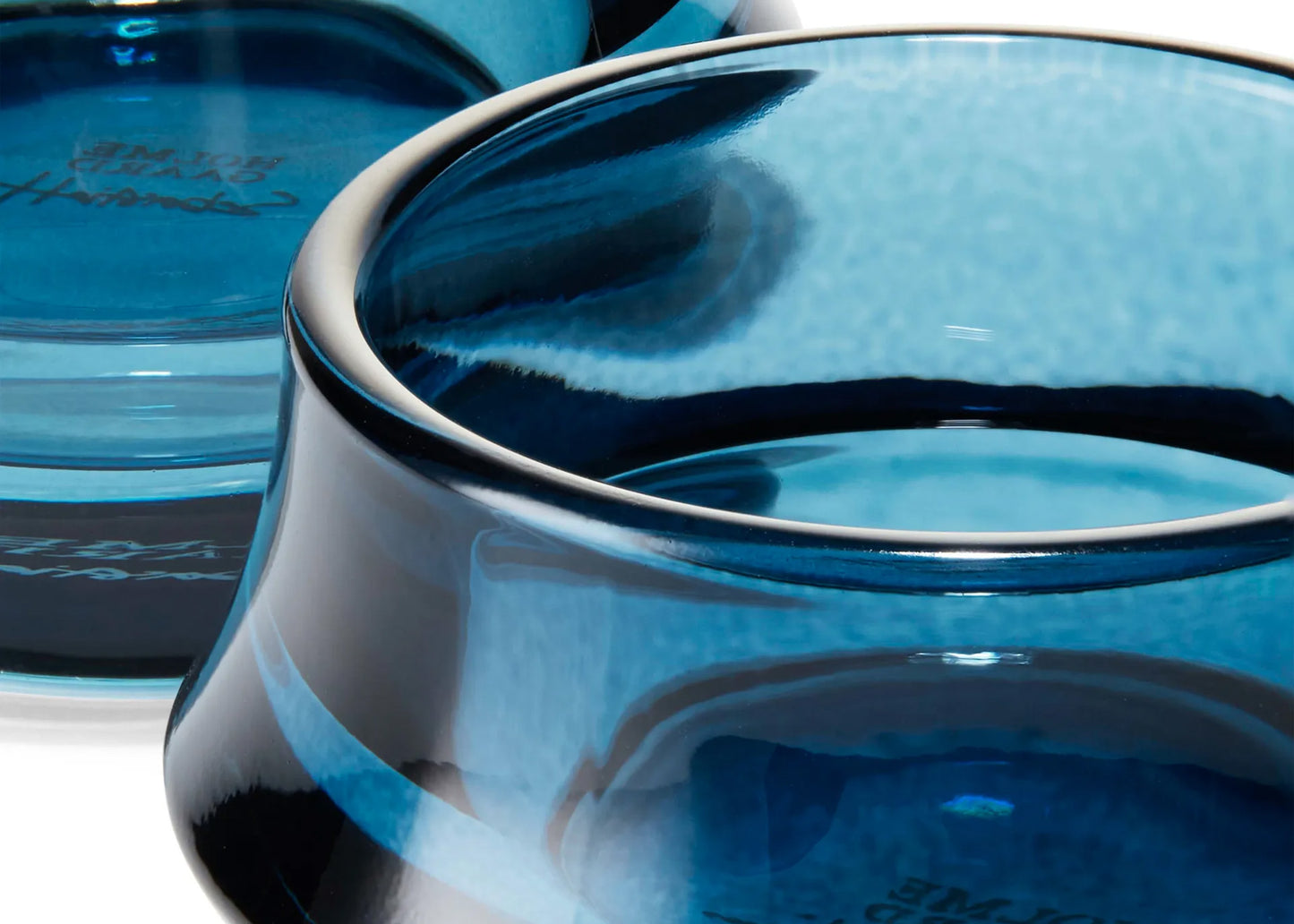 
                  
                    Close-up of a blue ceramic bowl with 
 branding.
                  
                