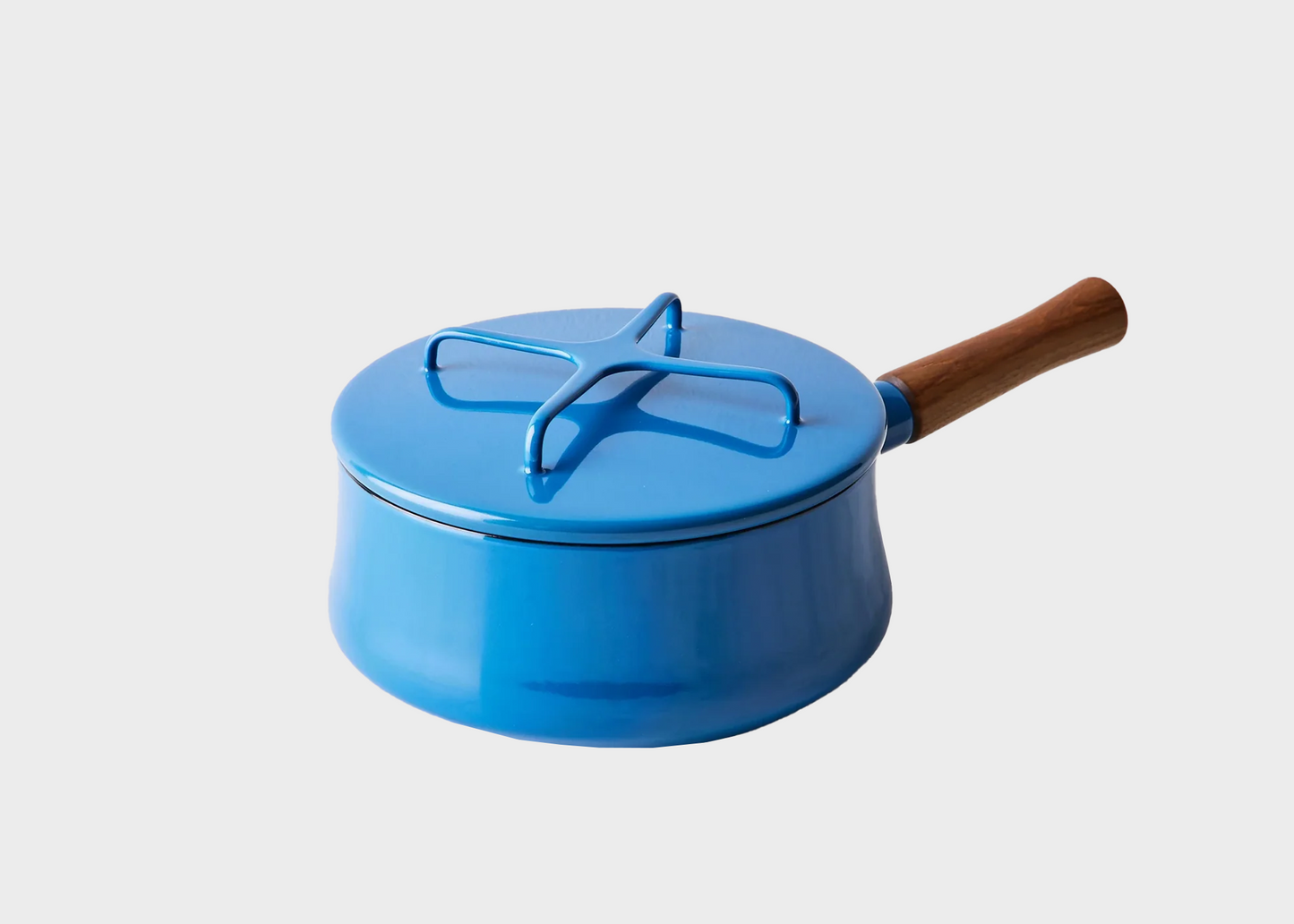 
                  
                    Blue Dansk enamel pot with a wooden handle on a white background
                  
                