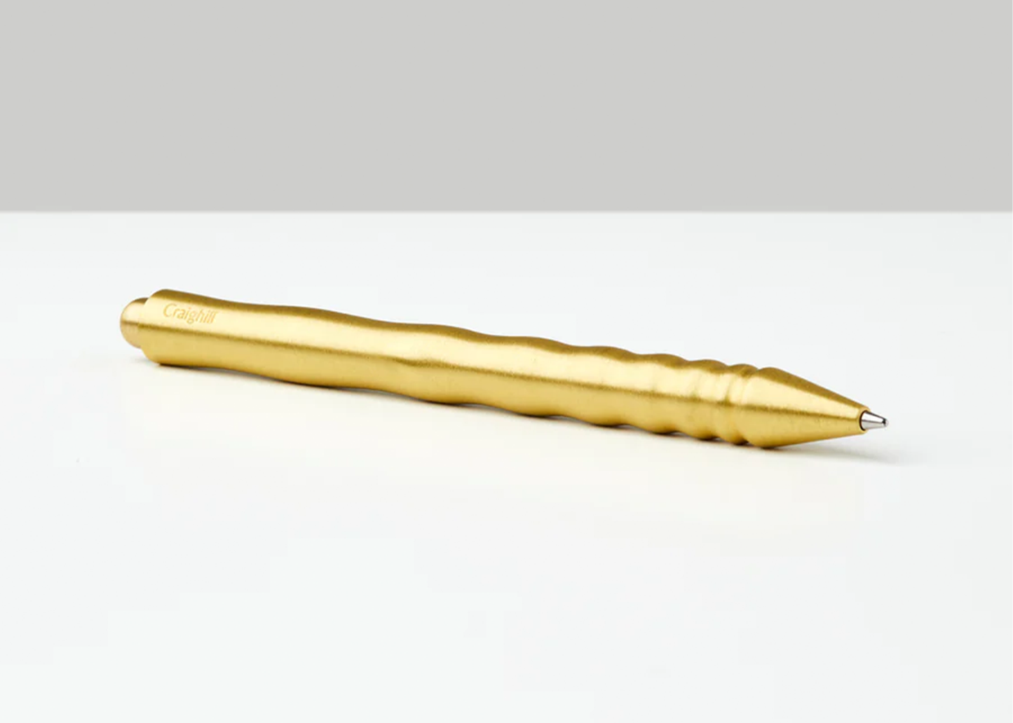 
                  
                    Gold pen on a white background
                  
                