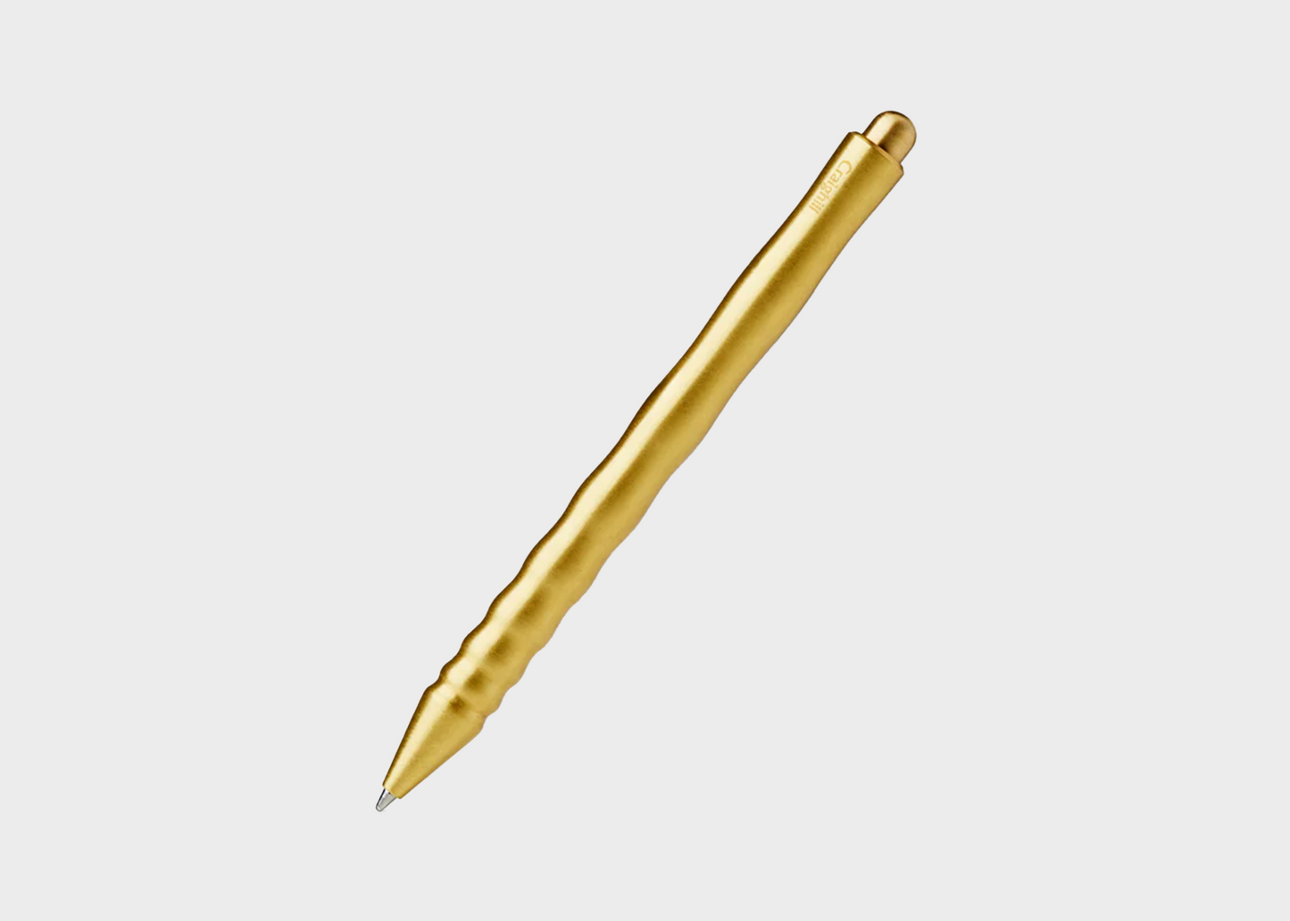 Gold pen on a white background