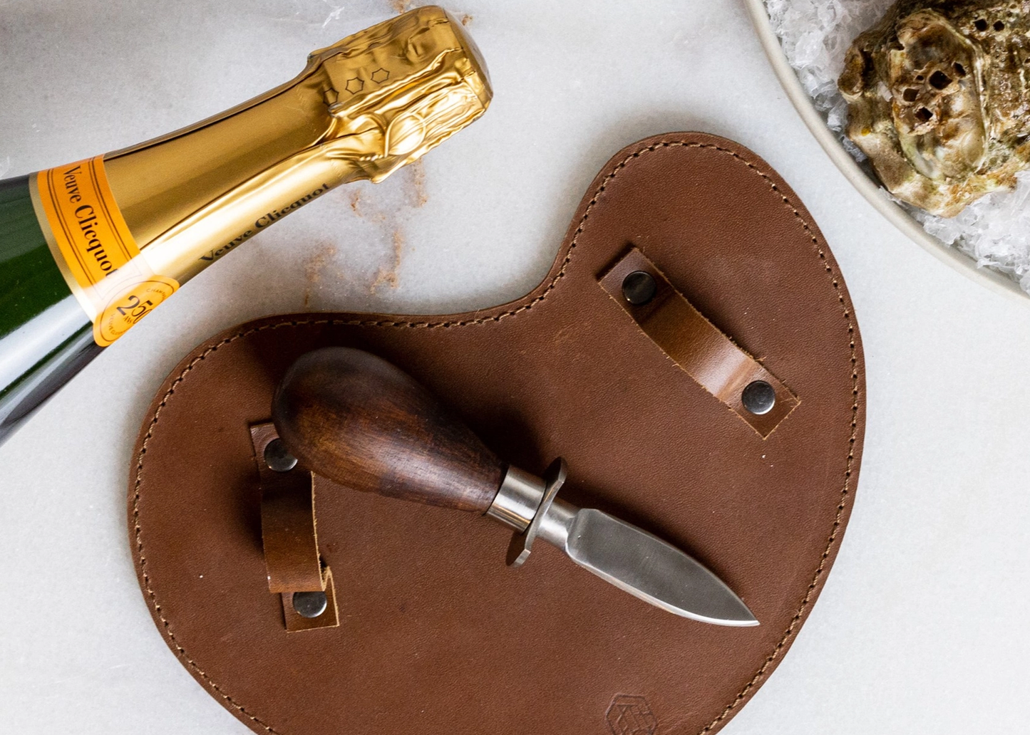 
                  
                    Oyster Set with Leather Glove
                  
                
