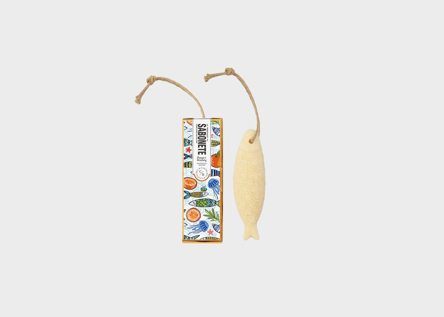Decorative fish-shaped soap with a label on a light gray background