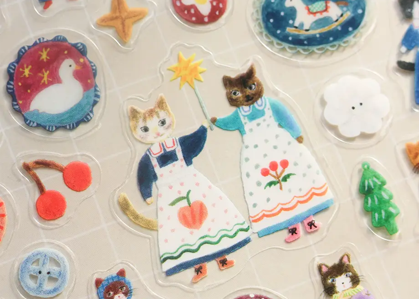 
                  
                    Collection of colorful stickers featuring cartoon characters and objects on a light background.
                  
                