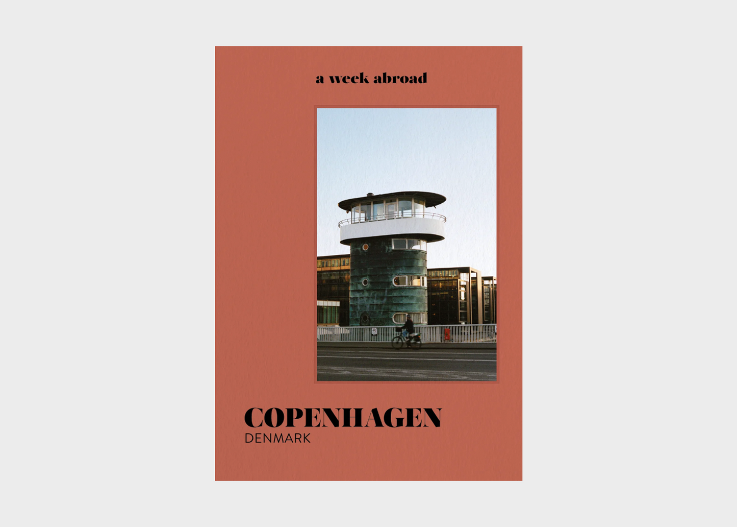 
                  
                    Book cover with a photo of a building in Copenhagen, Denmark, on a red background.
                  
                