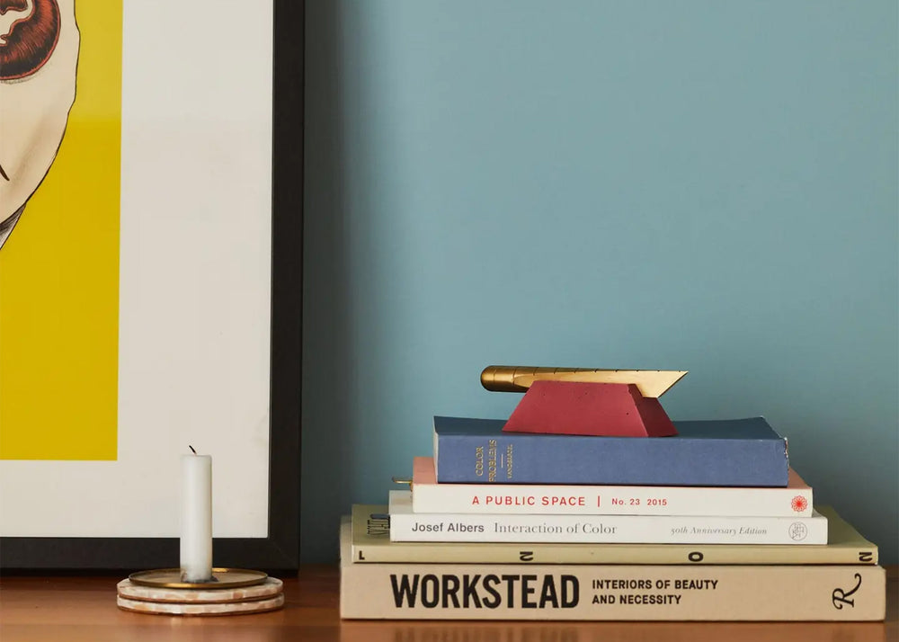 
                  
                    Desk Knife by Craighill in Gold Brass on a stack of books
                  
                