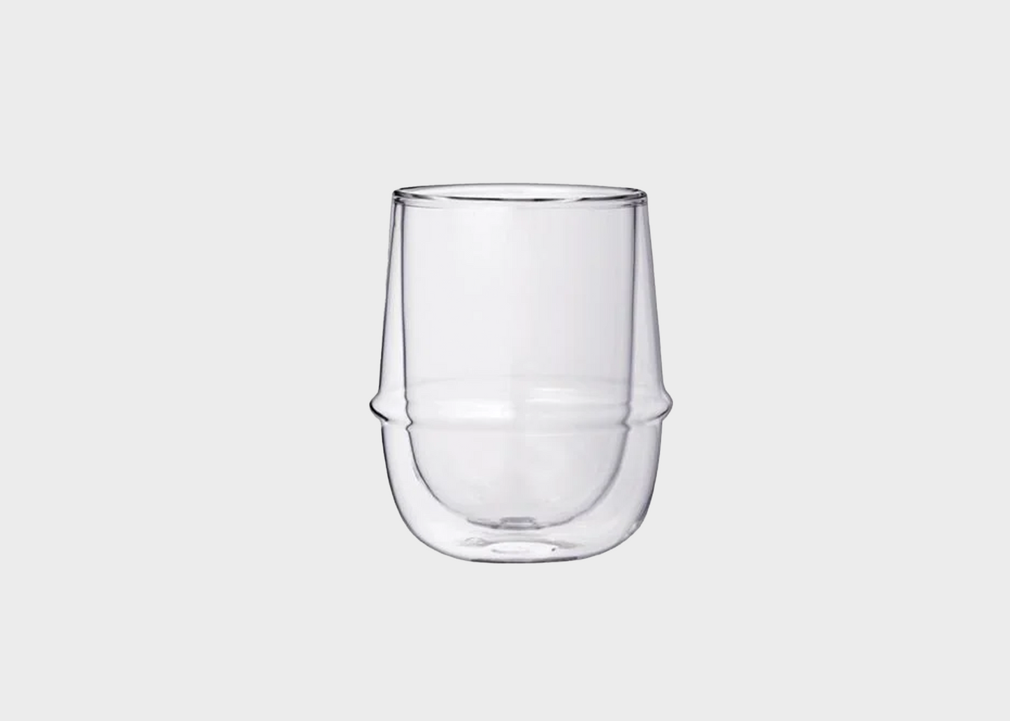 Clear glass tumbler on a light gray background as sold by Woodland Mod
