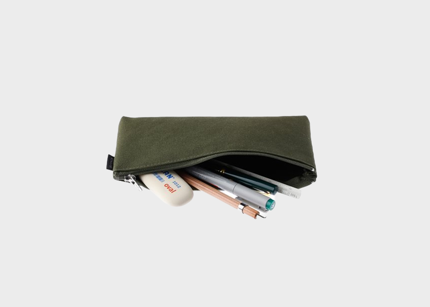 
                  
                    An olive green fabric pencil pouch with a zipper, shown open with pens and a white eraser peeking out against a light gray background.
                  
                