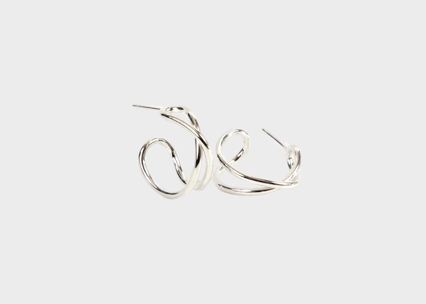 
                  
                    Crossover Hoop Earrings
                  
                
