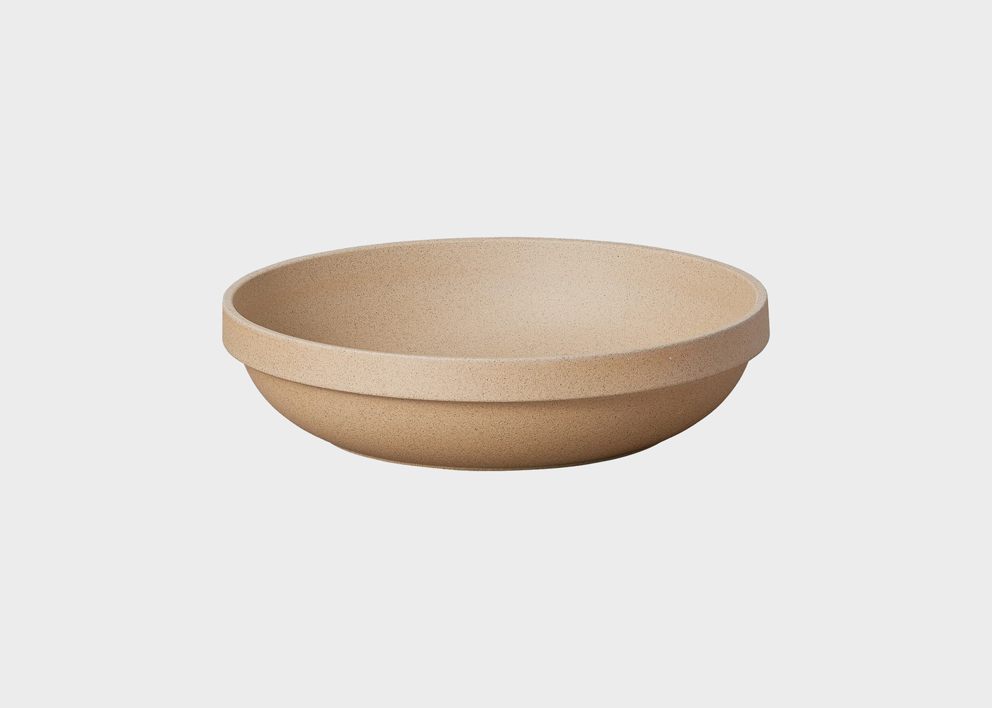 
                  
                    Beige ceramic bowl on a white background
                  
                