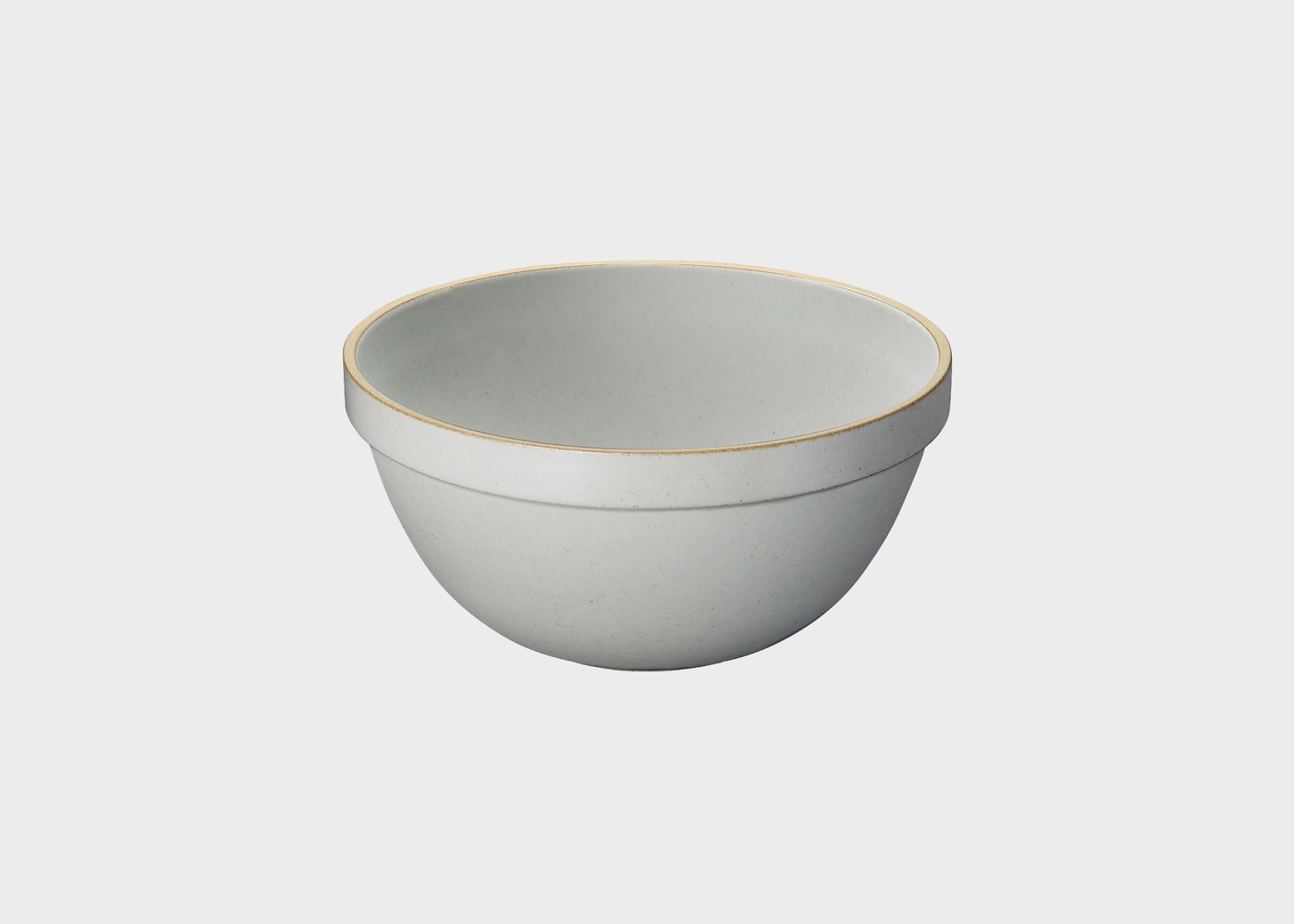 
                  
                    Light gray ceramic bowl with a natural rim on a white background
                  
                