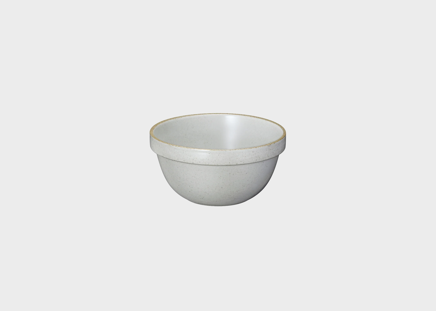 Light gray ceramic bowl on a light gray background
