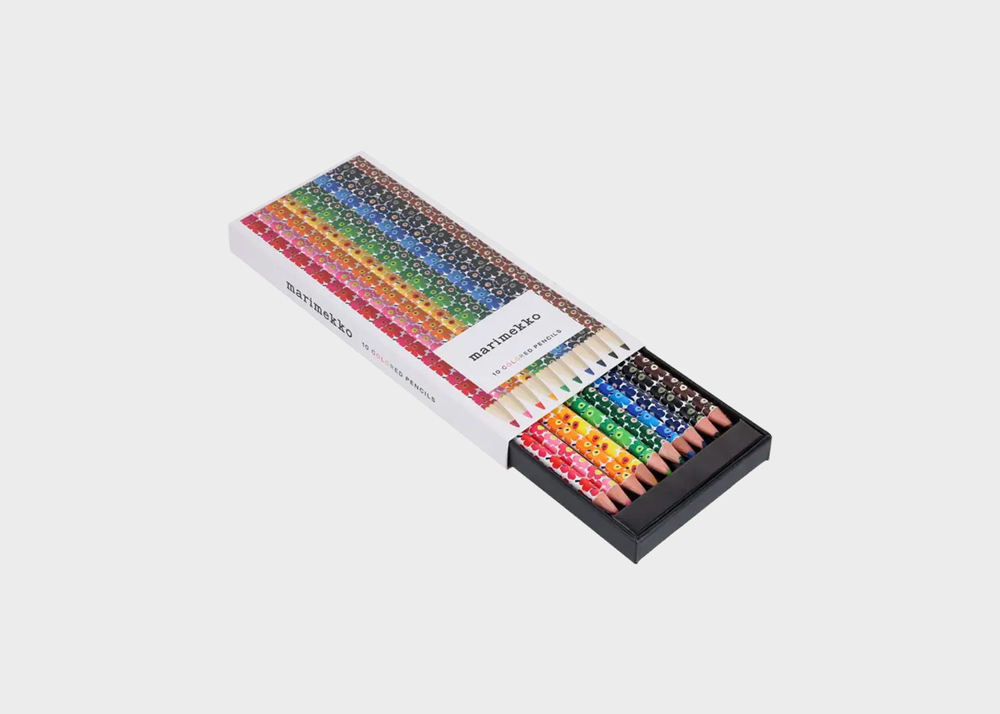 Set of colored pencils in a box on a white background