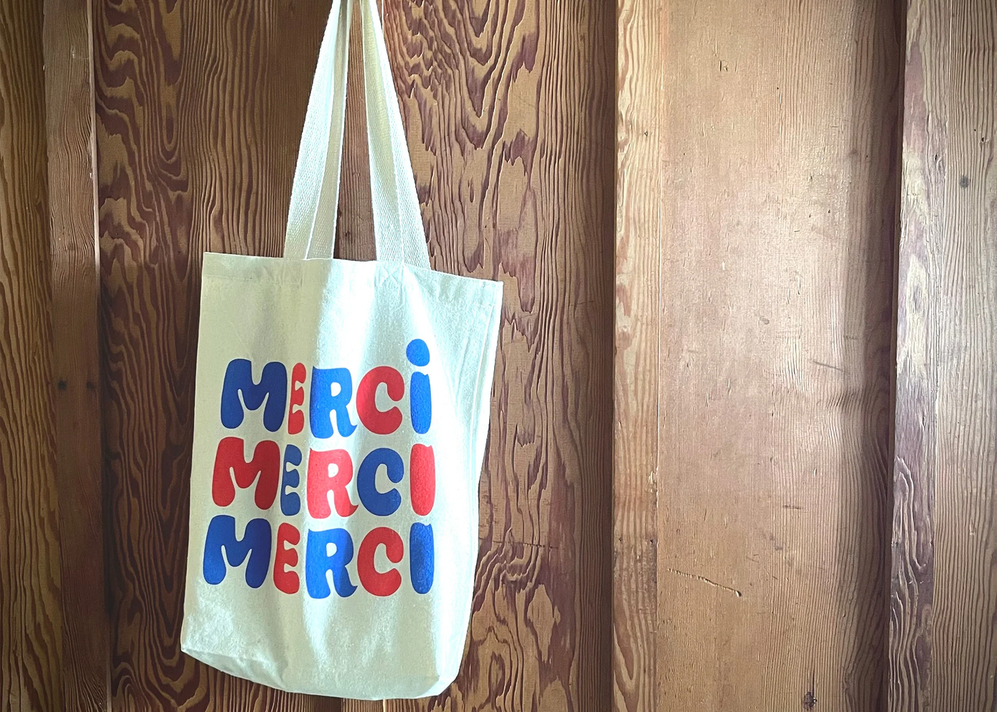 
                  
                    Merci Merci Graphic Tote
                  
                