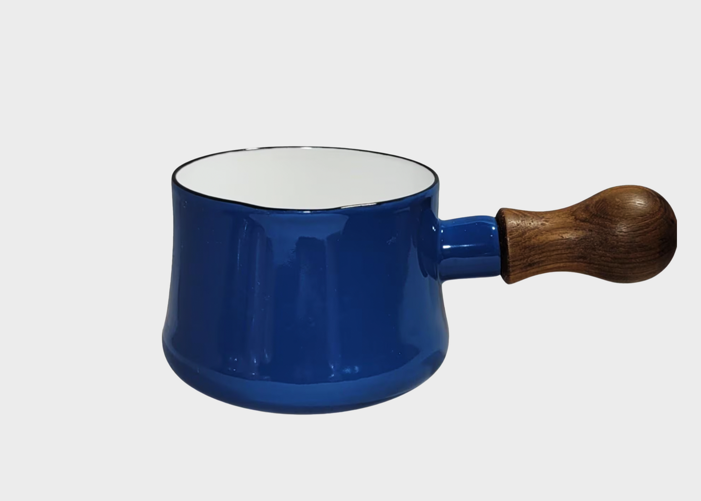 Blue enamel Dansk butter warmer pot with a wooden handle on a white background