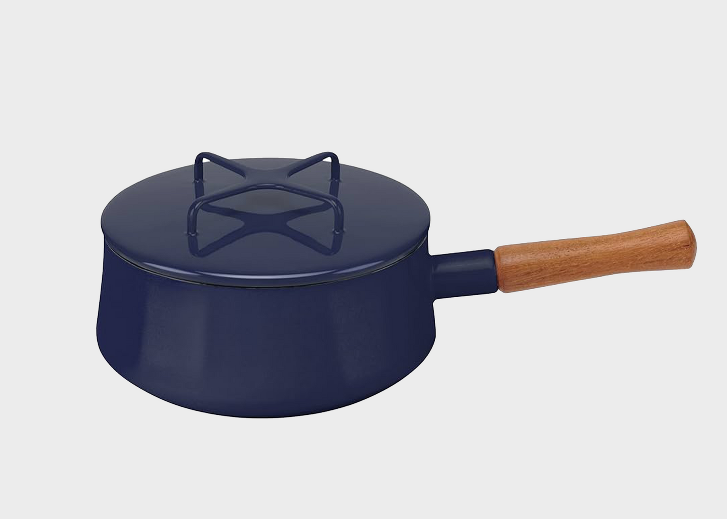 
                  
                    Blue Dansk enamel with a wooden handle on a light gray background
                  
                