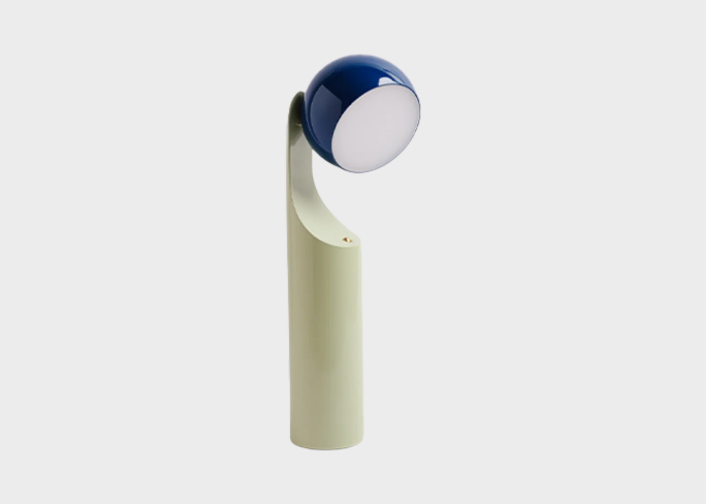 
                  
                    Modern table lamp with a blue shade on a white background
                  
                