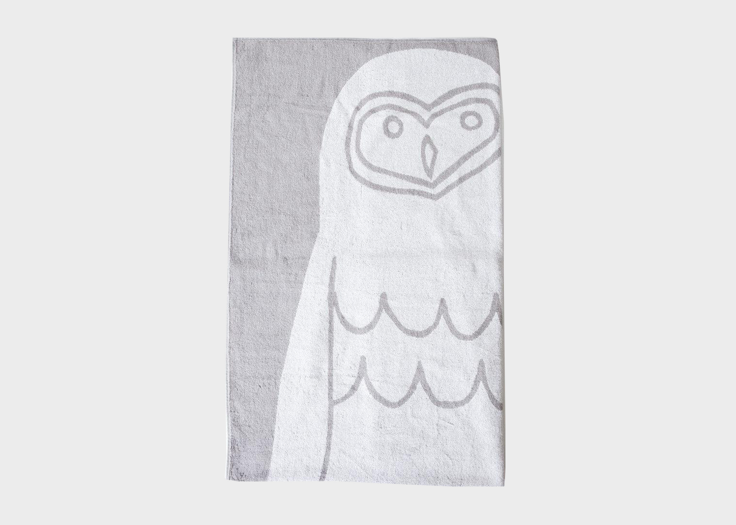 
                  
                    Textile product with an owl design on a gray background
                  
                