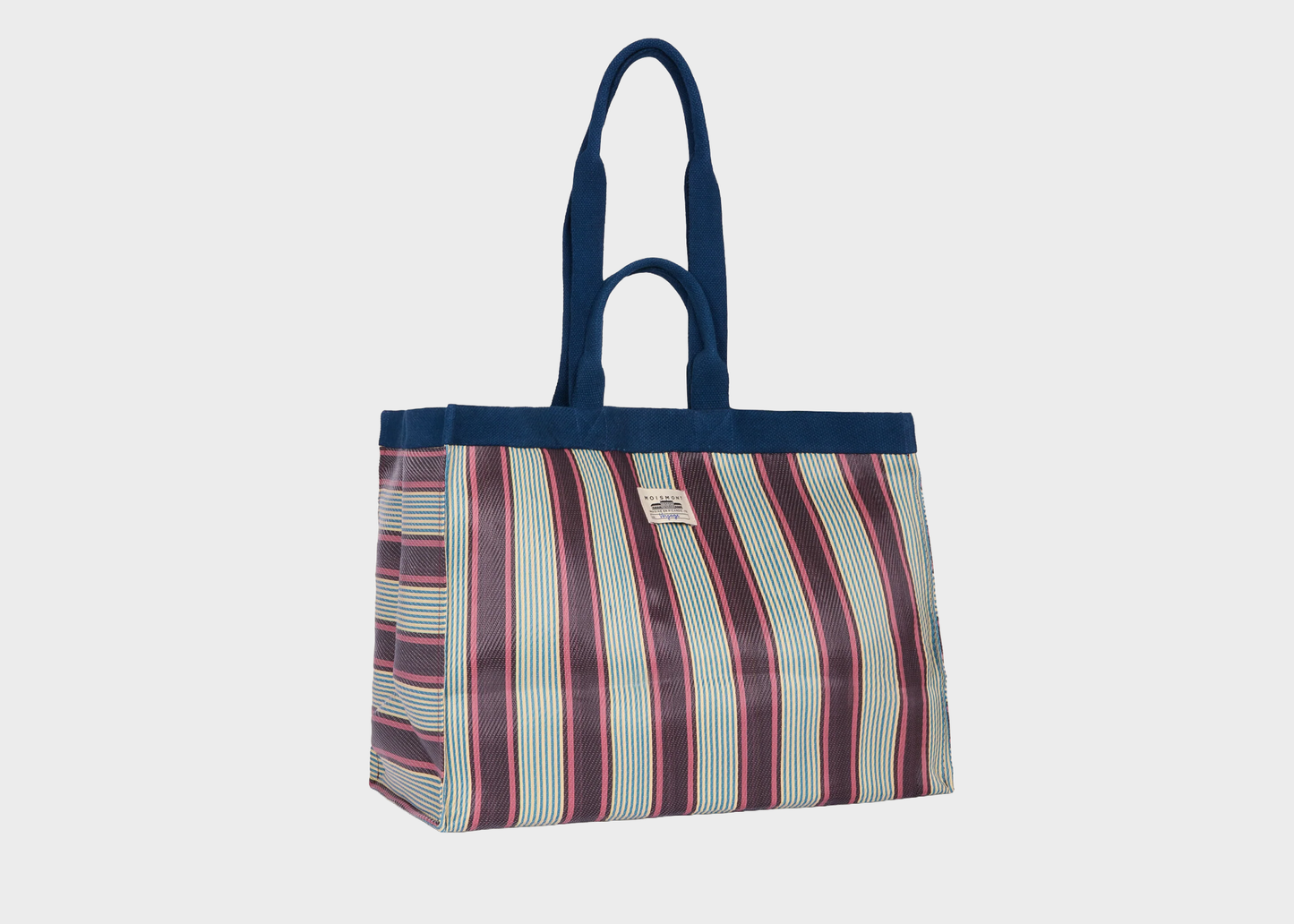 
                  
                    Striped tote bag with a blue top section on a light gray background
                  
                