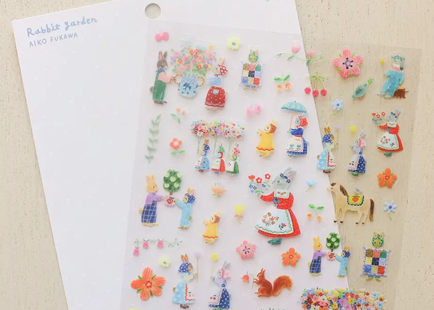 Decorative stickers with cartoon characters and flowers on a beige background