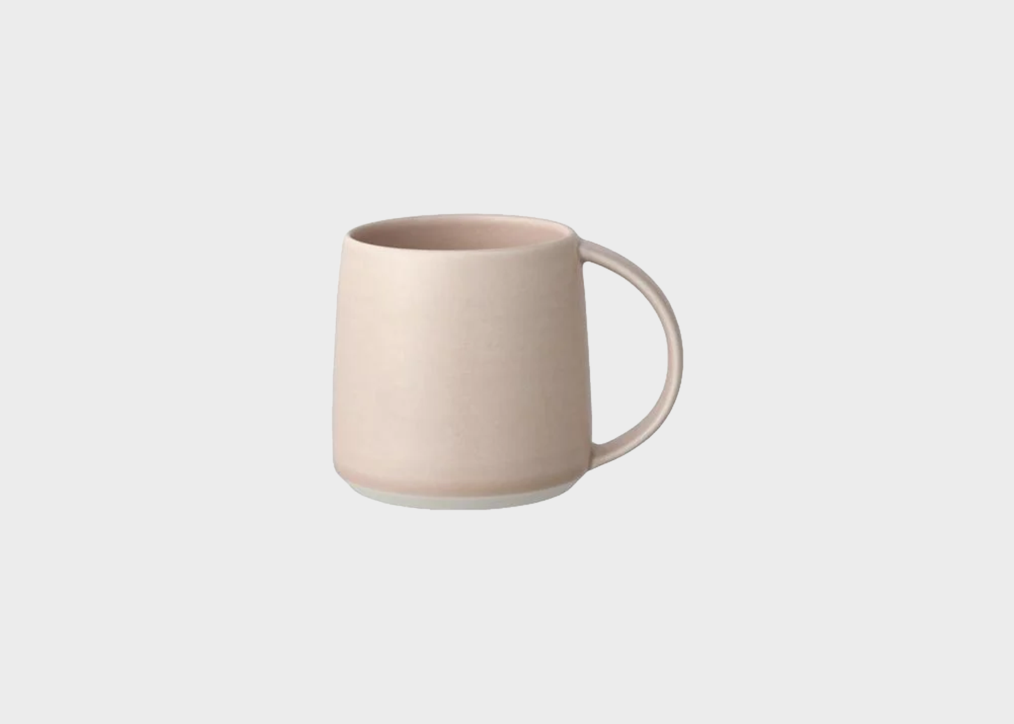 
                  
                    Beige ceramic mug on a light gray background
                  
                