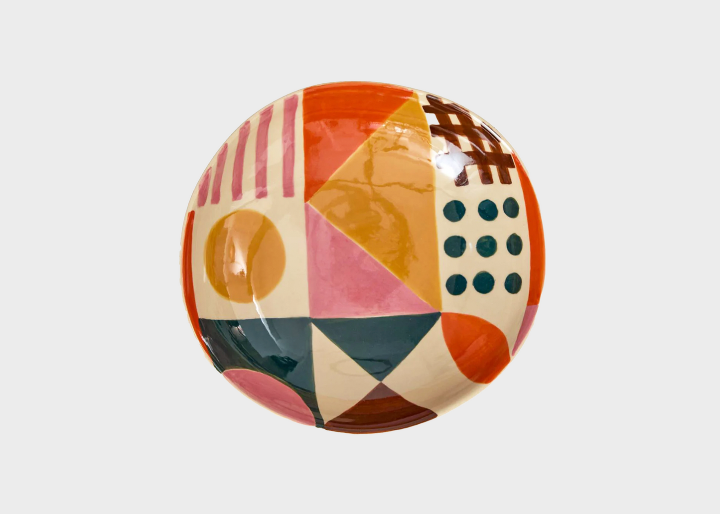 Decorative plate with geometric multicolor pattern on a light gray background